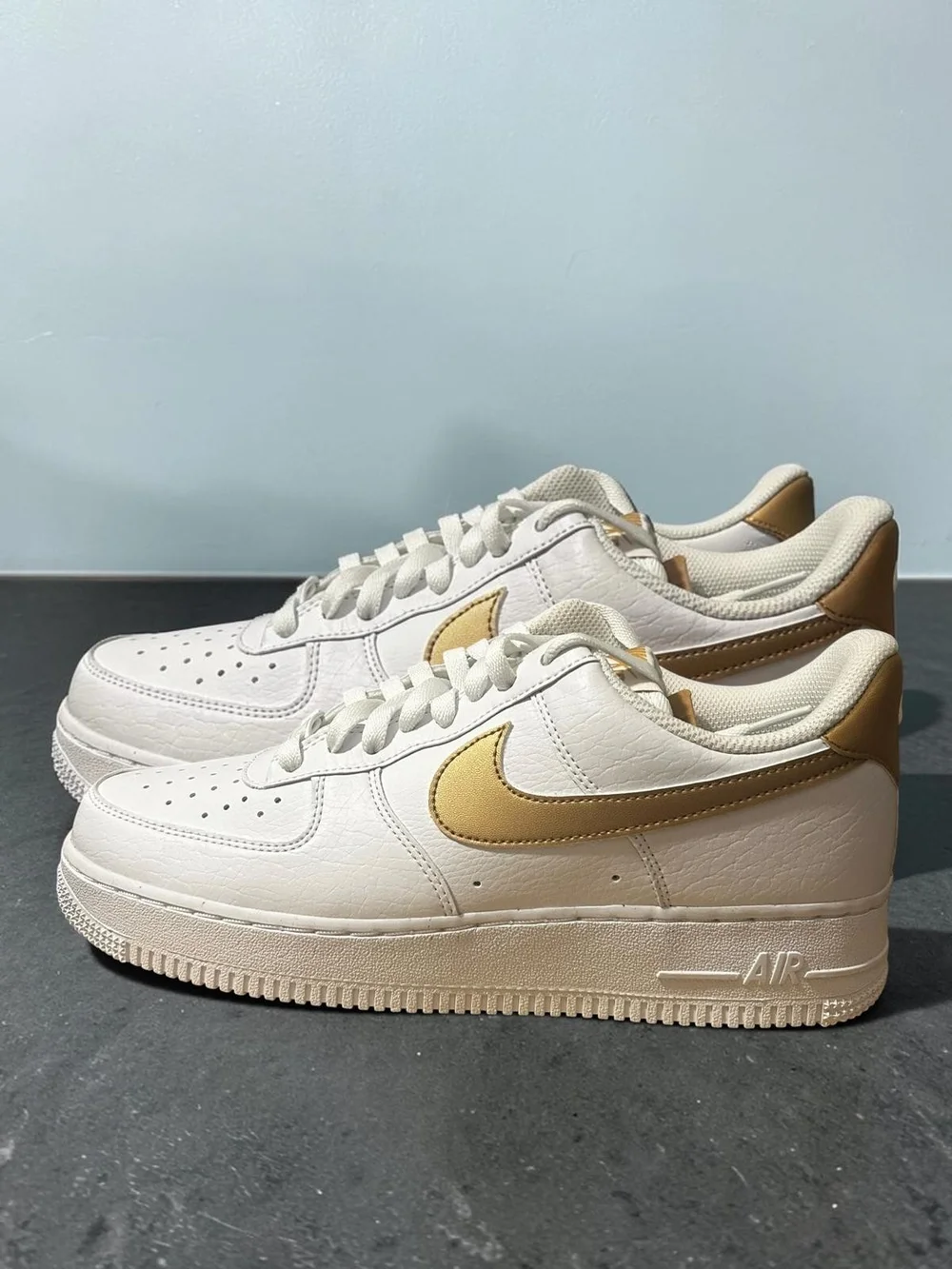 Nike Leather Low-Top Sneaker - White with Gold Swoosh